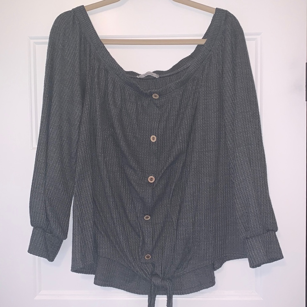 Dark grey off shoulder top. Great transition piece for fall.